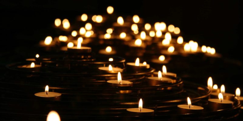 low-angle photo of lightened candles