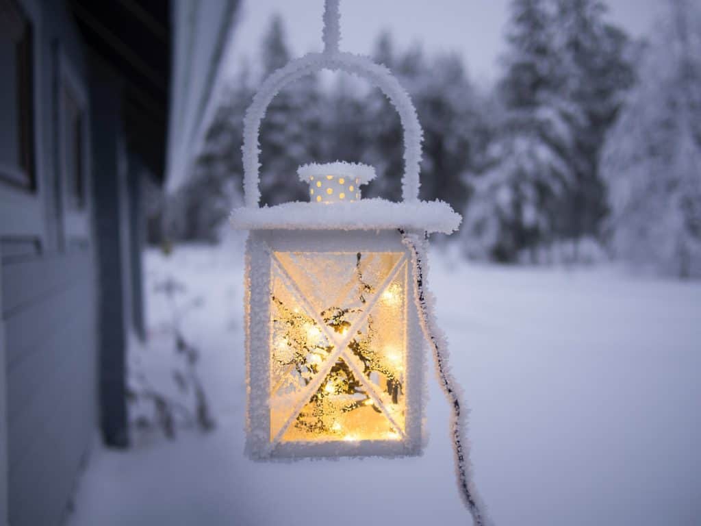 Frosty outdoor lantern on cold winter evening.